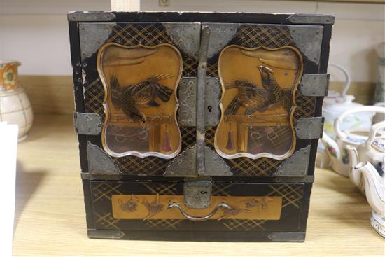 A Japanese lacquer cabinet on stand
